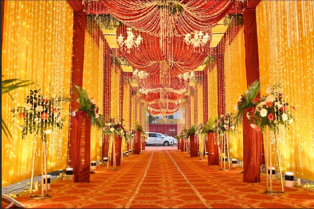 Red and gold wedding aisle at 7 Vachan, Patna