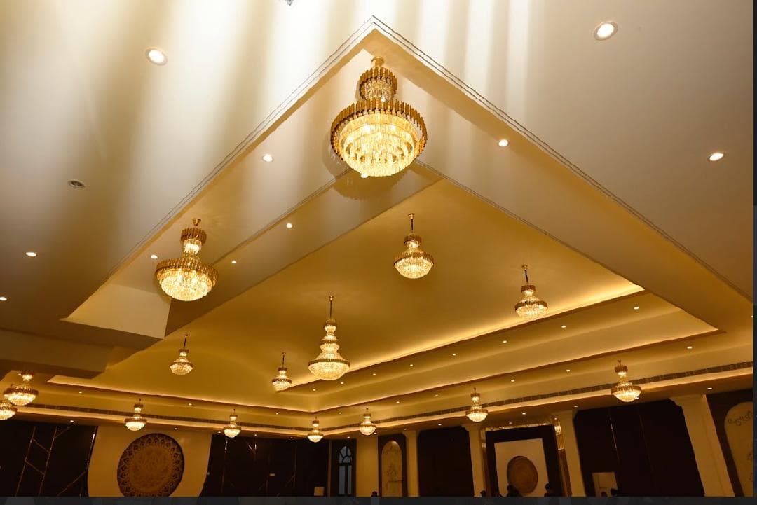 Luxurious banquet hall interior with golden chandeliers at 7 Vachan Patna